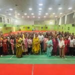 Group photo of teachers and staff attending an interdisciplinary training session led by Dr. Hemanth Kadambi in the school auditorium.